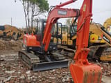Doosan DH55 crawler excavator, front three-quarter view