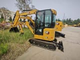 2026 Caterpillar 302CR mini excavator, front three-quarter view