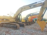 Caterpillar 325C crawler excavator, side profile view
