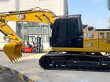 2022 Caterpillar 320GX crawler excavator, side view