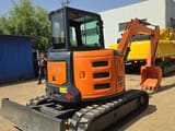 2023 Hitachi ZX55 mini excavator, front three-quarter view