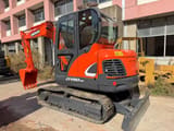 2023 Doosan DX60-9C mini excavator, front three-quarter view