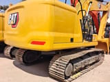 2024 Caterpillar 320GC crawler excavator, rear three-quarter view