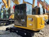 2025 Caterpillar 306 mini excavator, rear three-quarter view