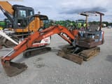 Hitachi EX26 mini excavator, side view