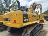 2024 Komatsu PC200 crawler excavator, rear three-quarter view
