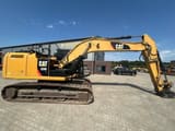 2014 Caterpillar 320EL crawler excavator, side view