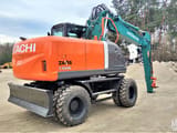 2012 Hitachi Zaxis 140W wheel excavator, rear three-quarter view