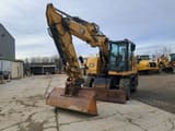 2018 Caterpillar M315F wheel excavator, front three-quarter view
