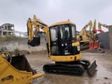 Caterpillar 303CR mini excavator, front three-quarter view