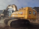 2024 Caterpillar 395 crawler excavator, rear three-quarter view