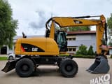 2012 CAT M313D wheel excavator side view