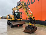 2016 Caterpillar M316F wheel excavator, front three-quarter view