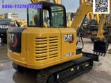 2024 Caterpillar 305.5E2 mini excavator, rear three-quarter view