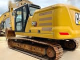 2023 Caterpillar 320 crawler excavator, rear three-quarter view