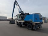 2026 Fuchs MHL360 F material handler, rear three-quarter view