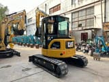 2022 Caterpillar 303.5 C CR mini excavator, rear three-quarter view