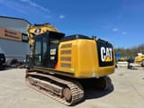 2017 Caterpillar 320FL crawler excavator, rear three-quarter view