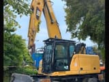2018 Caterpillar MH3022 material handler, front three-quarter view