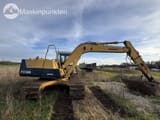1995 Komatsu PC120-5 crawler excavator, rear three-quarter view