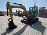 2023 Caterpillar 305.5E2 mini excavator, front three-quarter view