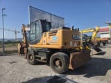 CASE WX148 wheel excavator, rear three-quarter view