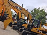 2023 Caterpillar 320CL гусеничний екскаватор, вигляд збоку