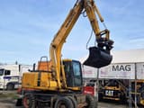 1998 Komatsu PW130ES-6K wheel excavator, side profile view