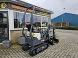 2023 Schaeff TC08 mini excavator, rear three-quarter view
