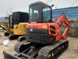 2022 Kubota U55-4 mini excavator, rear three-quarter view