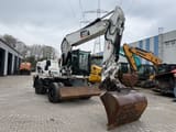 2010 Caterpillar M316D wheel excavator, front three-quarter view