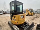 2019 Caterpillar 303.5E mini excavator, rear three-quarter view