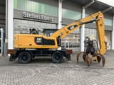 2018 Caterpillar MH3024 material handler, side view