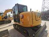 2024 Caterpillar 307E2 mini excavator, rear three-quarter view