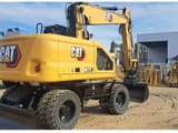 2024 Caterpillar M318-07 wheel excavator, rear three-quarter view