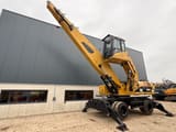 2008 Caterpillar M325D material handler, side view