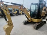 2023 Caterpillar 303.5E mini excavator, front three-quarter view
