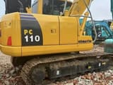 2024 Komatsu PC110 crawler excavator, rear three-quarter view