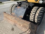 2008 Caterpillar M318D wheel excavator dozer blade view