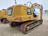 2019 Caterpillar 323 crawler excavator, rear three-quarter view