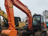 2025 Hitachi ZX120 crawler excavator, front three-quarter view