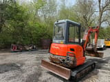 2014 Kubota KX101-3 mini excavator, front three-quarter view