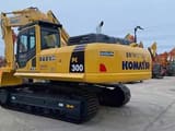 Komatsu PC300 crawler excavator, rear three-quarter view