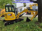 2023 Caterpillar 303.5E mini excavator, side view