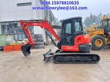 2023 Kubota KX057-4 mini excavator, side view