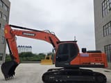 2024 Doosan DX225LCA crawler excavator, side profile view