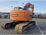 2014 Doosan DX235LCR crawler excavator, rear three-quarter view