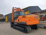 2023 Develon DX140LC crawler excavator, rear three-quarter view