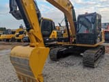Caterpillar 312D2GC crawler excavator, front three-quarter view