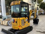 2025 Caterpillar 302 mini excavator, front three-quarter view